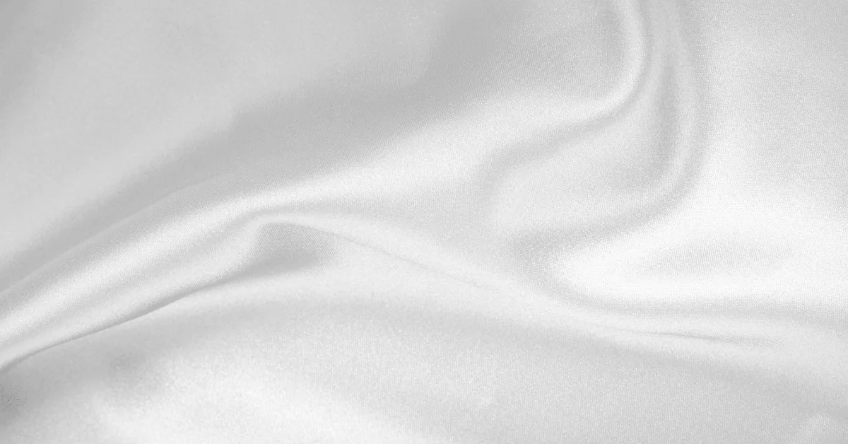Macro texture of satin wrap film catching soft studio light